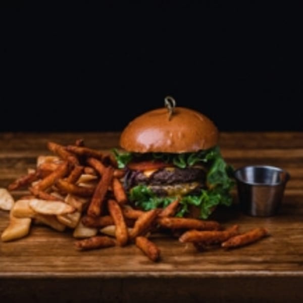 BB's Burger Factory's double cheeseburger with lettuce, tomato, and a side of fries.